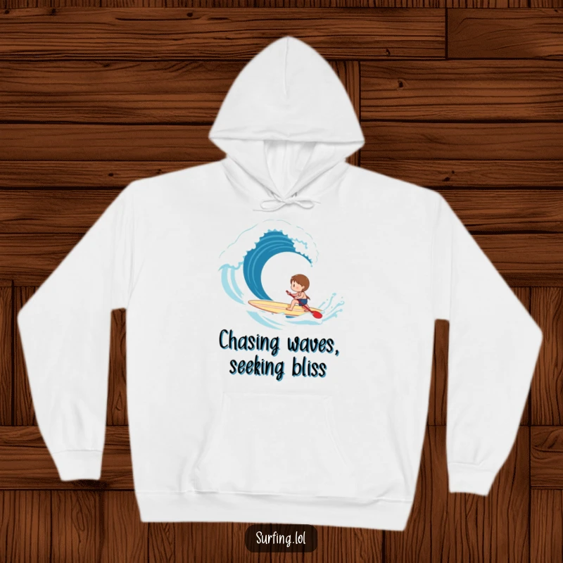 Funny Hoodie: A happy character paddles a surfboard with effort towards an exciting breaking wave, embodying focus.