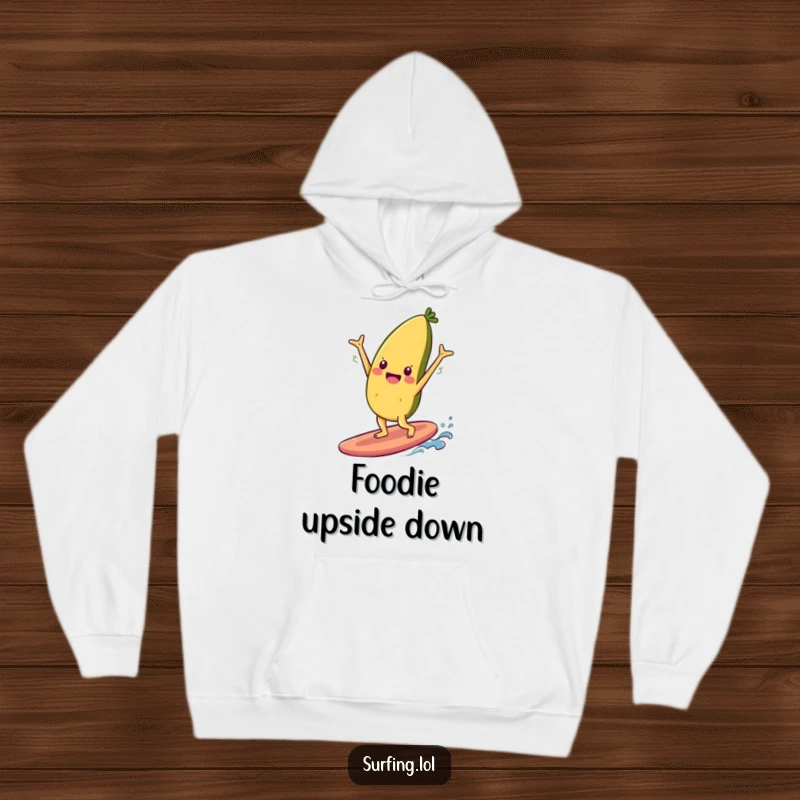 Funny hoodie featuring a cheerful food item character doing a handstand on a surfboard, combining quirky fun and cozy style.